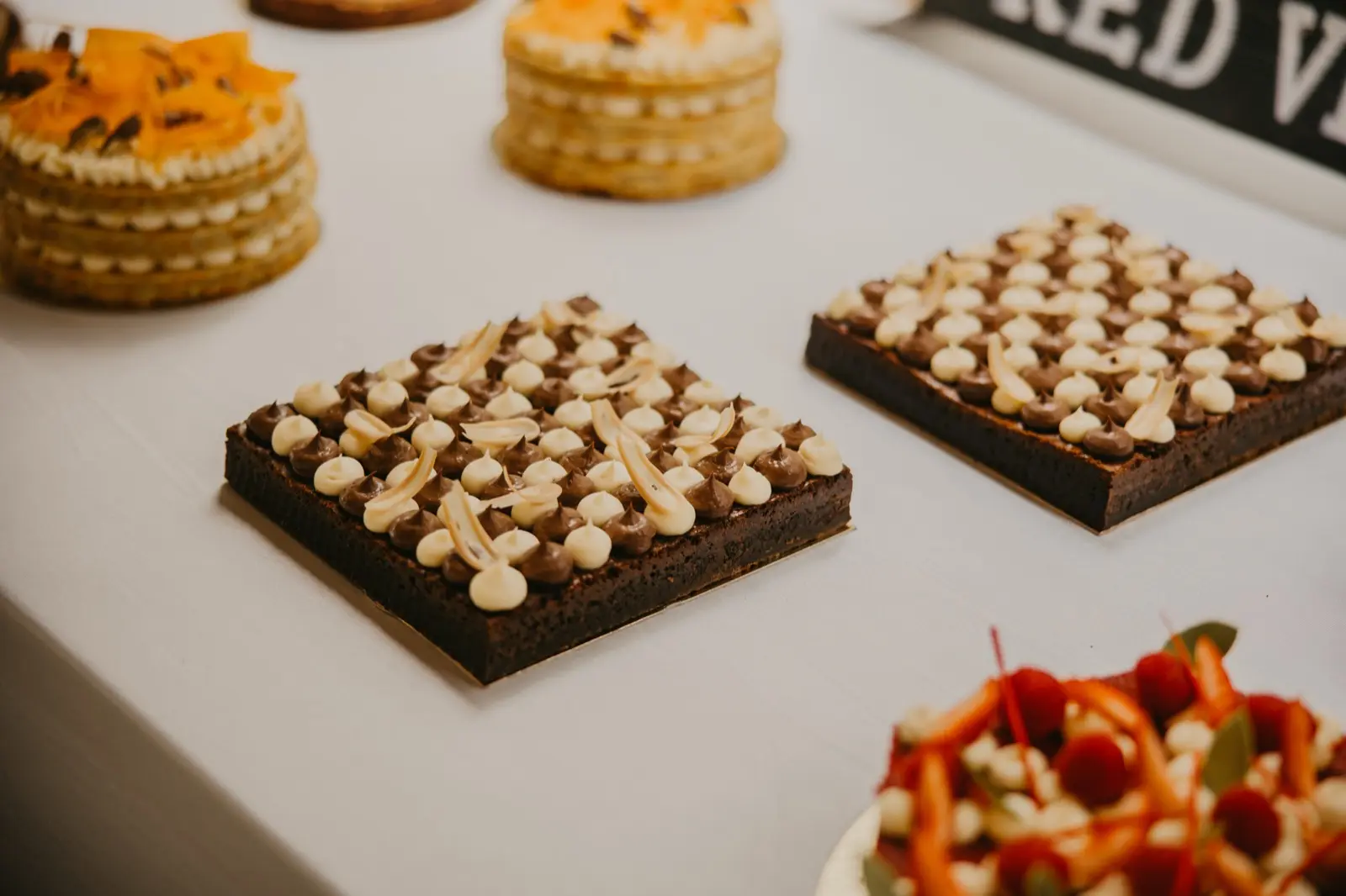 Chocolate brownies with cream decoration
